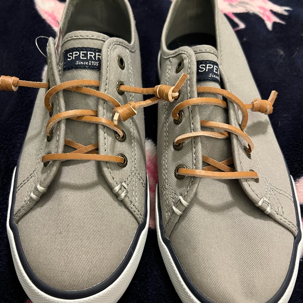 Brand new Sperry sneakers. Size 8.5. Never worn. Leather shoe laces. Memory foam